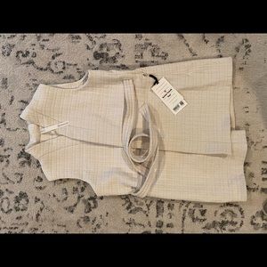 Serene travels vest; Cream long vest with belt.